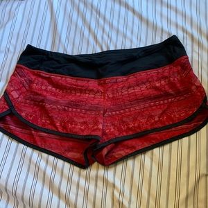 Red print Lululemon shorts with black lining